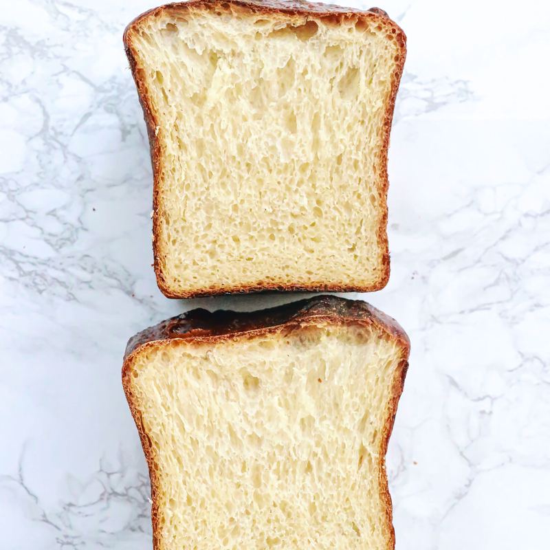 A golden braided brioche loaf