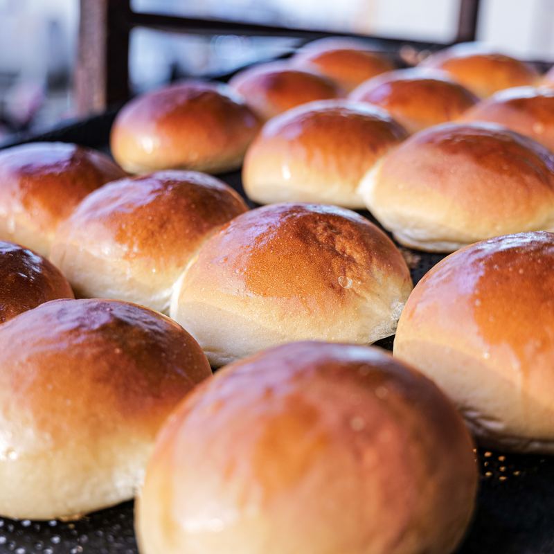 Golden glazed brioche buns fresh from the oven