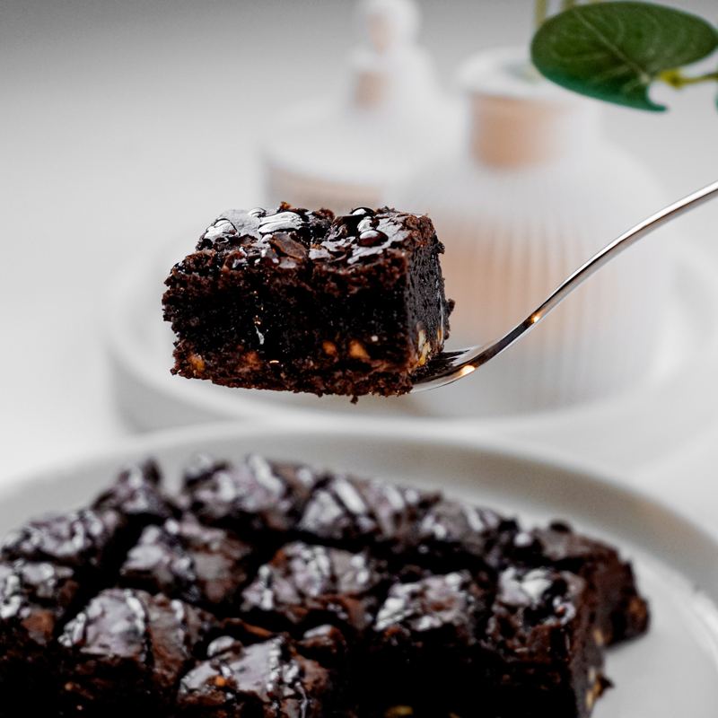 Slices of dark chocolate Guinness cake with cream topping