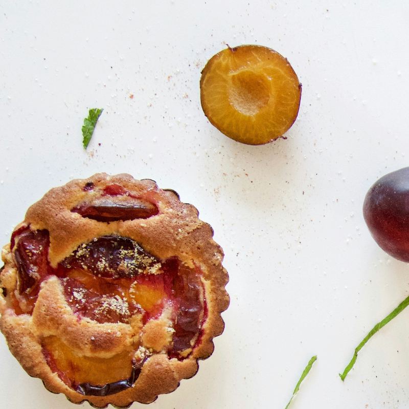 Small fruit tartlets filled with custard and fresh fruit