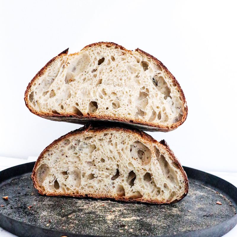 A rustic floured sourdough boule